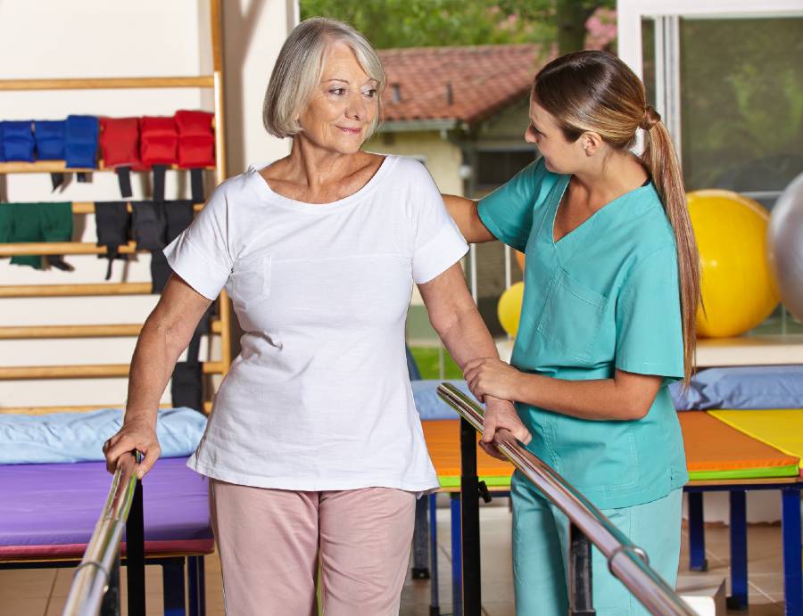 Senior woman working with a physical therapist