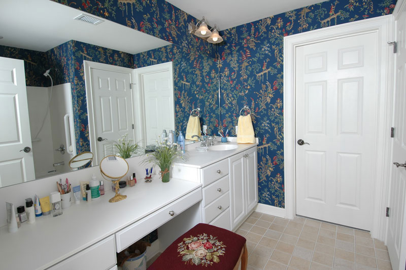 A photo of a senior apartment bathroom with a large vanity for makeup